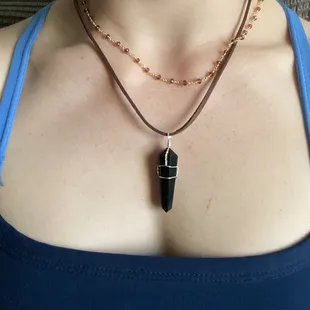 ruby necklace and black obsidian pendulum necklace.