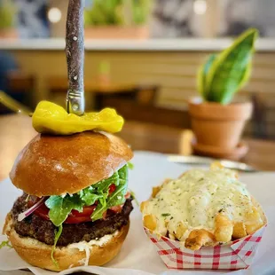 Meraki Steak Burger - brioche bun, American Wagyu, feta cheese &amp; Tzatziki sauce. Ordered it w/ Feta Fries, of course