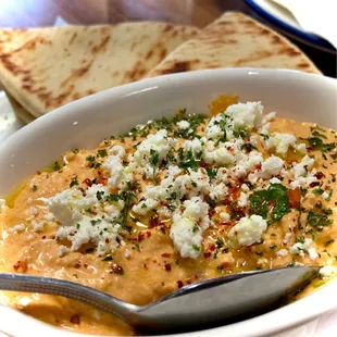 Tirokafteri: Feta cheese and Roasted Red Pepper (not spicy) served with warm pita bread