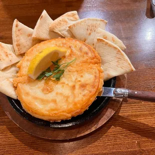 A Cheese dish that is baked, maybe fried? Delicious!