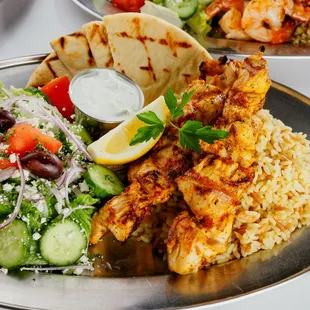 Chicken Kalamakia. Includes Greek Salad, Pita and Tzatziki. Choice of Greek Rice, Aegean Quinoa or French Fries.