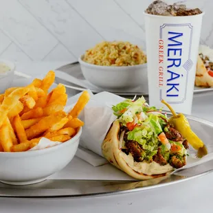 Falafel Pita (Chickpea Fritters, Hummus, Tomato, Lettuce, Cucumber, Red Onion, Red Radish, Tzatziki)