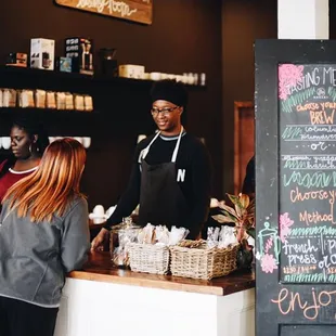 a woman standing at the counter