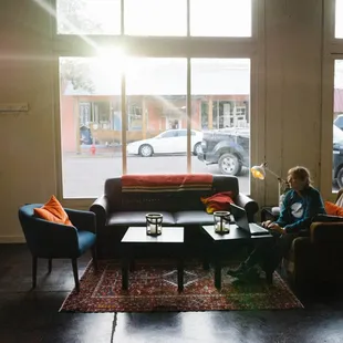 a woman sitting on a couch