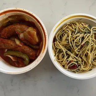 two bowls of spaghetti and meat