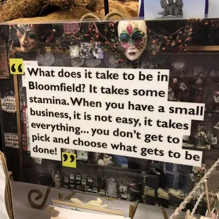 a picture of a display case with a sign that says what does it take to be in bloomfield?