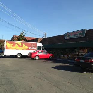 cars parked in front of a store