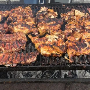 the meat being cooked on the grill
