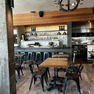 a view of a restaurant with tables and chairs