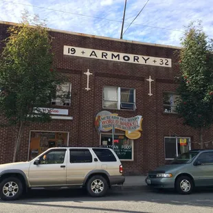 two cars parked in front of a building