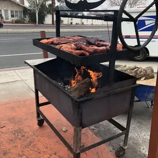 a grill with meat on it