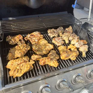 chicken cooking on a grill