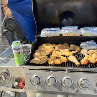 chicken cooking on a grill