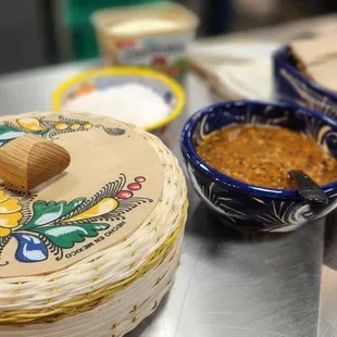 Fresh tortilla samples with butter, salsa and salt