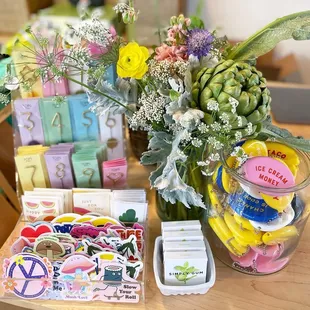 a vase of flowers and stickers