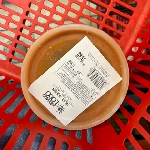 a bowl of soup on a red chair