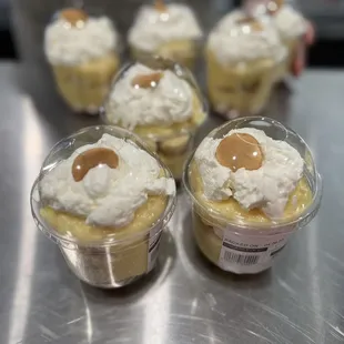 desserts in plastic containers on a table