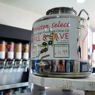 a jar of olive oil and a bottle of olive oil