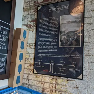 a brick wall with a sign on it