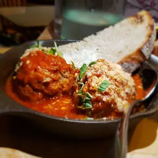 meatballs and bread in a skillet