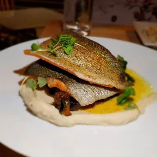 a plate of fish and mashed potatoes