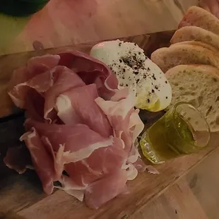 Prosciutto, burrata, baguette, and garlic olive oil