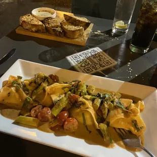 The exceptional lobster ravioli and the not so great garlic bread.