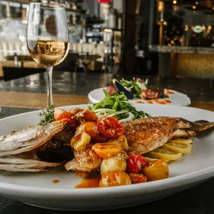 Branzino: Spicy Calabrian Tomato Sauce, Arugula, Fennel &amp; Charred Lemon.