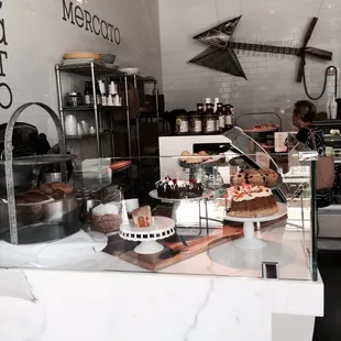 a counter with a variety of desserts