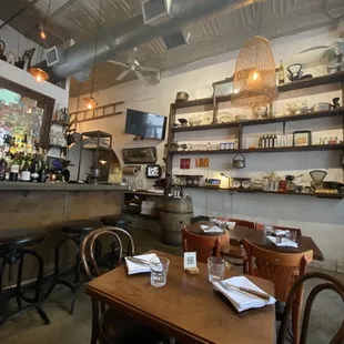 a view of a restaurant with tables and chairs