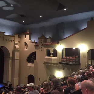 a crowd of people watching a man on stage