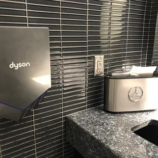 Dyson and emblem imprinted paper towel holder of course