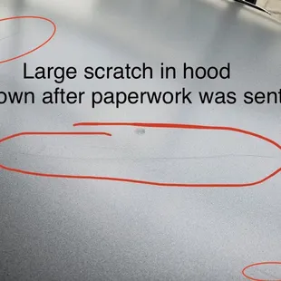 Multiple LARGE scratches in the hood not disclosed