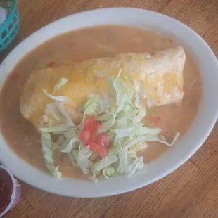 Chicken and bean burrito smothered in medium chili