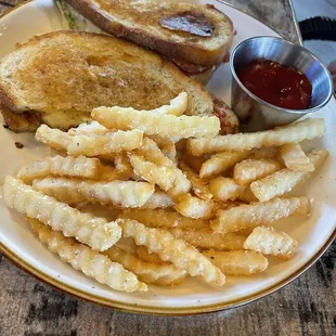 Pesto grilled cheese sandwich with fries