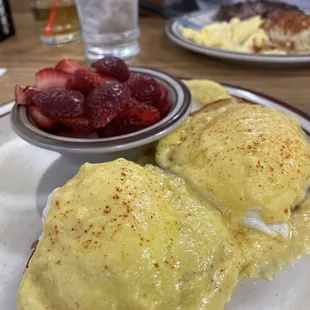 Eggs Benedict with strawberries.