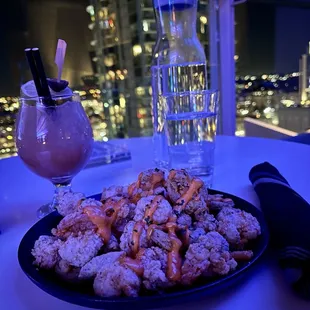 Fried shrimp and a Silver Linings cocktail