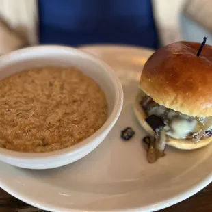 a hamburger and a bowl of soup
