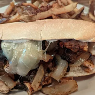 Chicken philly sandwich with fries