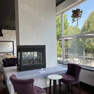 a view of a living room with a fireplace