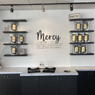 a coffee shop counter and shelves