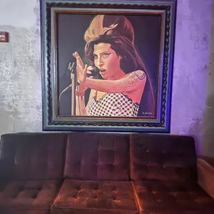 a painting of a woman playing a guitar