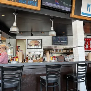 a woman sitting at the bar