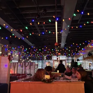 people sitting at a table in a restaurant