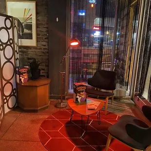 a living room with a red carpet