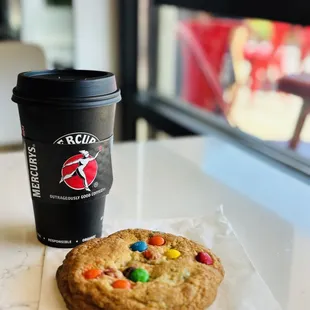 a cookie and a cup of coffee