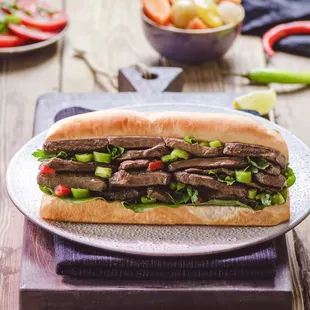 Beef Liver sandwich with green peppers, lettuce and tahini. Comes with Tots!