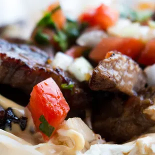 Carne asada con tajadas. grill beef with banana chips