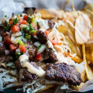 Carne asada con tajadas. grill beef with banana chips
