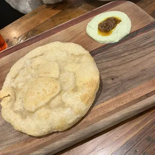 a wooden cutting board with food on it